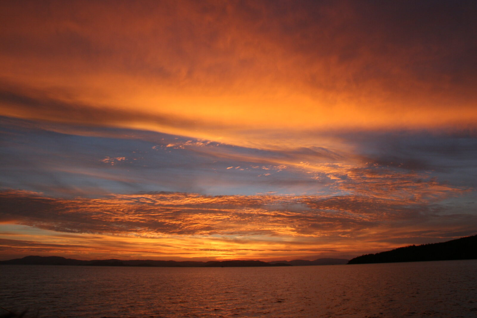 sunset-over-the-water-orange-sky