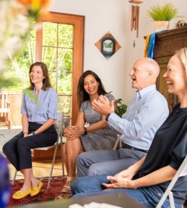 adult-group-class-laughing group-of-adults-sitting-in-chairs-laughing